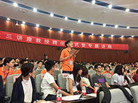 Students enthusiastically raise questions after lecture